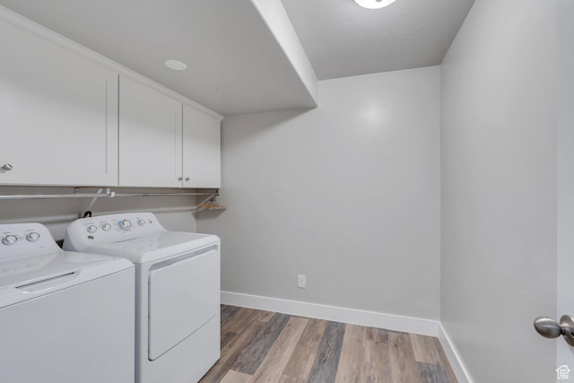 9844 N Faust Station Dr W, Eagle Mountain, UT 84005 - laundry room featuring light wood finished floors, baseboards, separate washer and dryer, and cabinet space