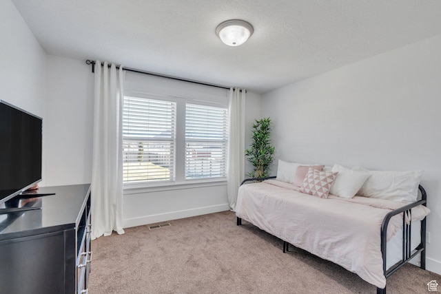 9844 N Faust Station Dr W, Eagle Mountain, UT 84005 - bedroom with baseboards, visible vents, and carpet flooring
