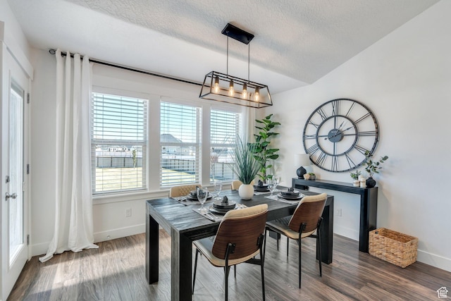 9844 N Faust Station Dr W, Eagle Mountain, UT 84005 - dining room with baseboards, wood finished floors, and a textured ceiling