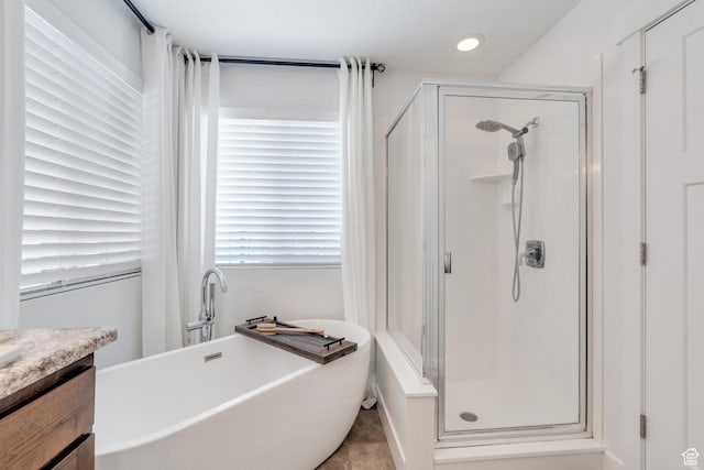 9844 N Faust Station Dr W, Eagle Mountain, UT 84005 - full bath with vanity, a freestanding tub, and a shower stall
