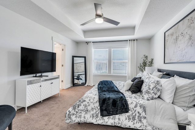 9844 N Faust Station Dr W, Eagle Mountain, UT 84005 - carpeted bedroom featuring baseboards, a textured ceiling, a ceiling fan, and a raised ceiling