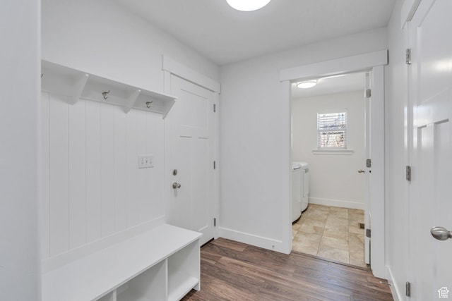 9844 N Faust Station Dr W, Eagle Mountain, UT 84005 - mudroom featuring washer and clothes dryer, wood finished floors, and baseboards