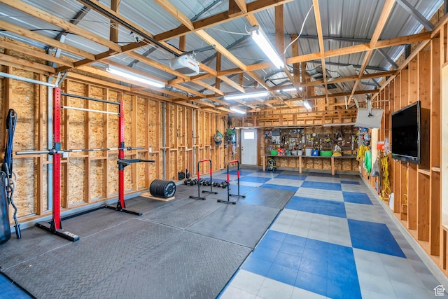 9844 N Faust Station Dr W, Eagle Mountain, UT 84005 - workout area with metal wall, a garage, and a workshop area