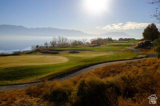 141 E Cottage Cv, Saratoga Springs, UT 84045 - view of community with golf course view, a mountain view, and a lawn