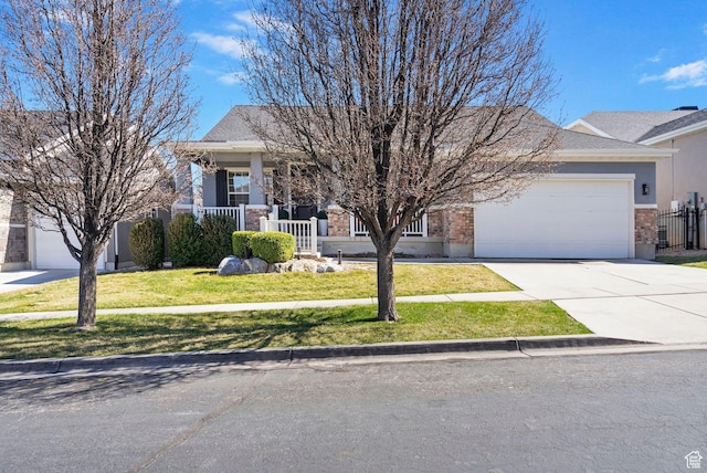 141 E Cottage Cv, Saratoga Springs, UT 84045 - view of property hidden behind natural elements featuring driveway, a front yard, covered porch, brick siding, and a garage