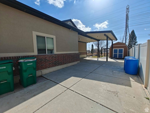 958 S Bridgecreek Ln, Layton, UT 84041 - view of patio with a storage unit, an outdoor structure, and fence
