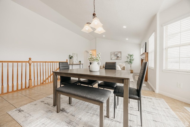 352 S 2000 E, Spanish Fork, UT 84660 - dining room with baseboards, lofted ceiling, light tile patterned floors, and a chandelier