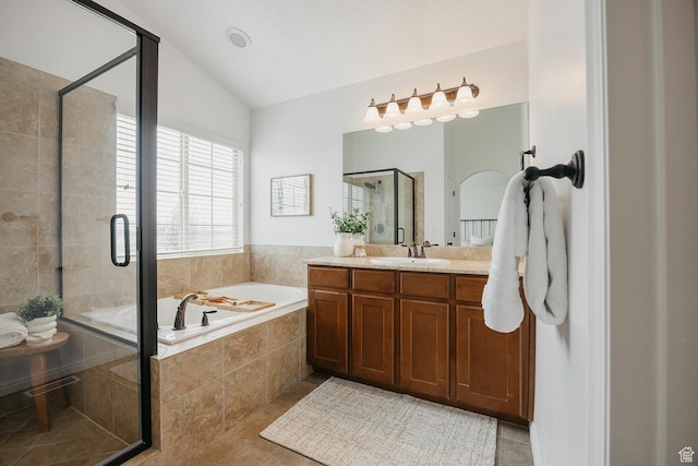 352 S 2000 E, Spanish Fork, UT 84660 - bathroom featuring tile patterned floors, vaulted ceiling, vanity, a garden tub, and a shower stall
