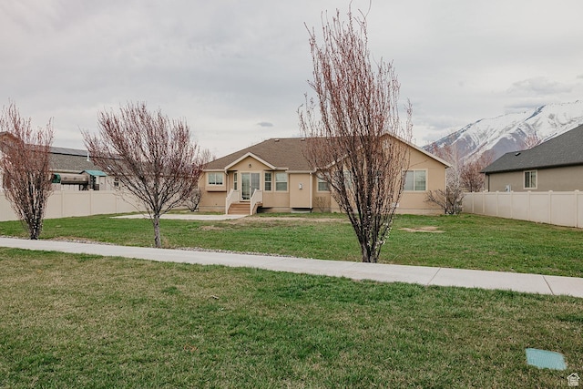 352 S 2000 E, Spanish Fork, UT 84660 - view of front facade featuring a front lawn, stucco siding, and fence