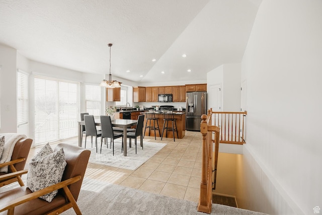 352 S 2000 E, Spanish Fork, UT 84660 - dining room with light tile patterned flooring, vaulted ceiling, recessed lighting, and a textured ceiling