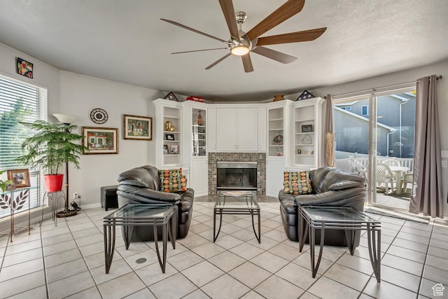 496 E Spruce Glen Rd, Murray, UT 84107 - living room featuring a ceiling fan, healthy amount of natural light, a fireplace, and light tile patterned floors