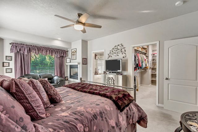 496 E Spruce Glen Rd, Murray, UT 84107 - bedroom with a spacious closet, light carpet, a closet, and a ceiling fan
