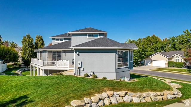496 E Spruce Glen Rd, Murray, UT 84107 - back of property featuring a shingled roof, a yard, and stucco siding