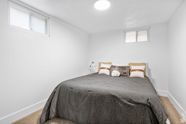 carpeted bedroom with baseboards