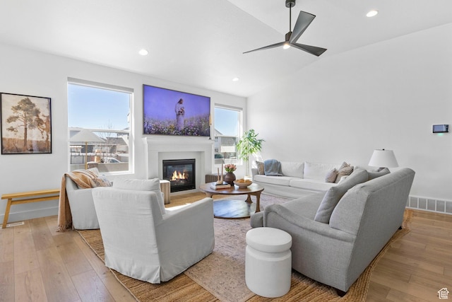 4947 W Evergreen Ln, Highland, UT 84003 - living area featuring recessed lighting, hardwood / wood-style flooring, a glass covered fireplace, and ceiling fan