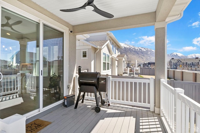 4947 W Evergreen Ln, Highland, UT 84003 - wooden terrace featuring a mountain view, area for grilling, a ceiling fan, and a residential view
