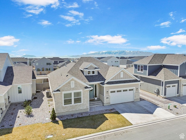 4947 W Evergreen Ln, Highland, UT 84003 - view of front of home with a residential view, driveway, a shingled roof, and an attached garage