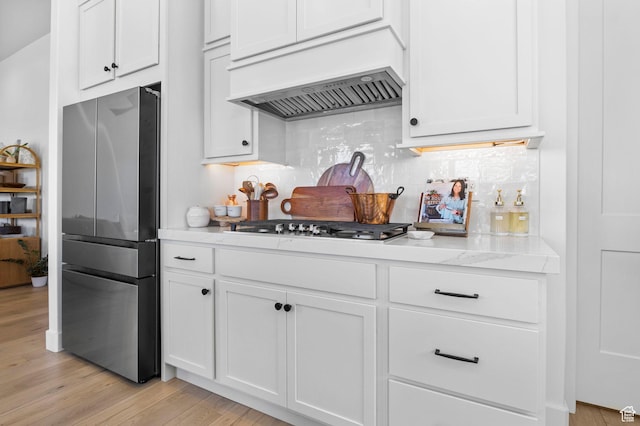 4947 W Evergreen Ln, Highland, UT 84003 - kitchen with white cabinets, tasteful backsplash, premium range hood, and appliances with stainless steel finishes