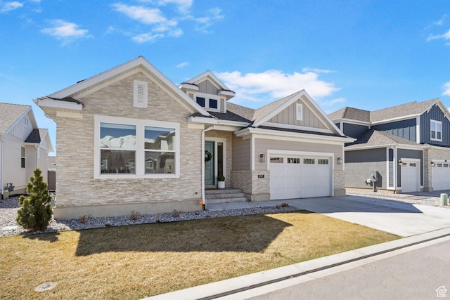 4947 W Evergreen Ln, Highland, UT 84003 - view of front of property featuring concrete driveway, stone siding, board and batten siding, a front yard, and a garage