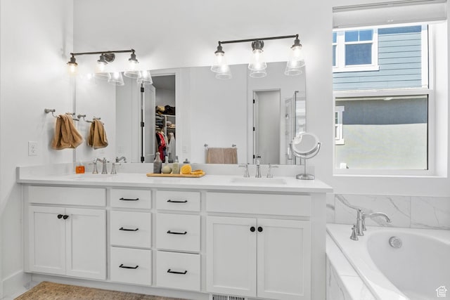 4947 W Evergreen Ln, Highland, UT 84003 - full bathroom featuring double vanity, a sink, and a bath