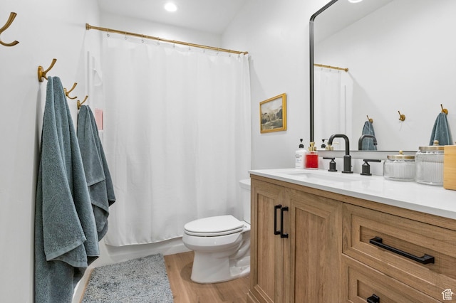 4947 W Evergreen Ln, Highland, UT 84003 - bathroom featuring toilet, vanity, curtained shower, and wood finished floors