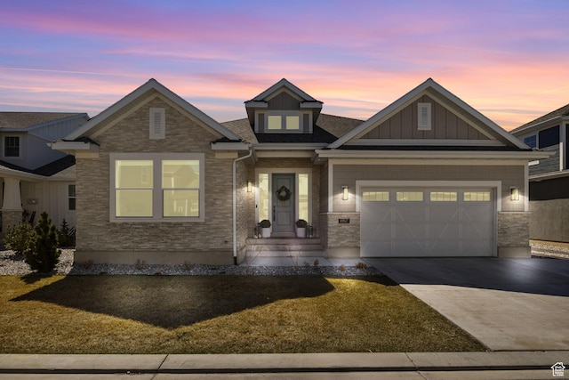 view of front facade featuring driveway, a garage, and board and batten siding