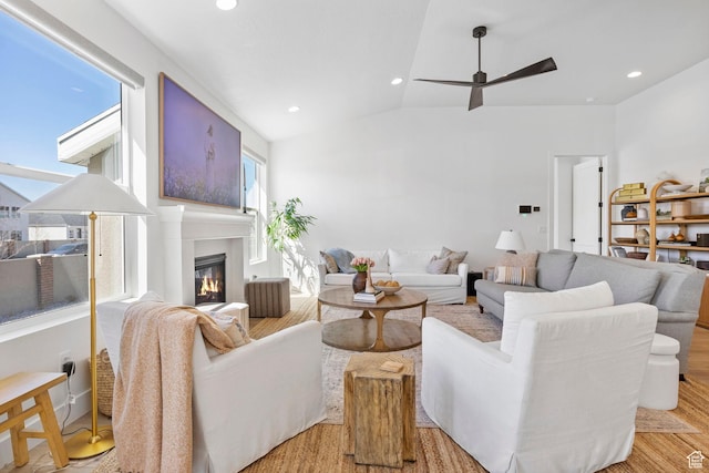 4947 W Evergreen Ln, Highland, UT 84003 - living room featuring recessed lighting, a ceiling fan, lofted ceiling, light wood-type flooring, and a glass covered fireplace