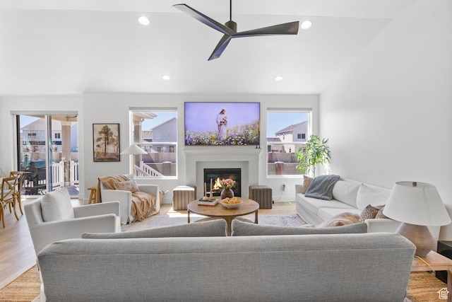 4947 W Evergreen Ln, Highland, UT 84003 - living area with light wood-style flooring, recessed lighting, a glass covered fireplace, and ceiling fan