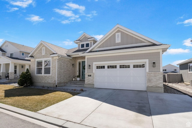 4947 W Evergreen Ln, Highland, UT 84003 - craftsman-style house with driveway, stone siding, board and batten siding, a front lawn, and a garage