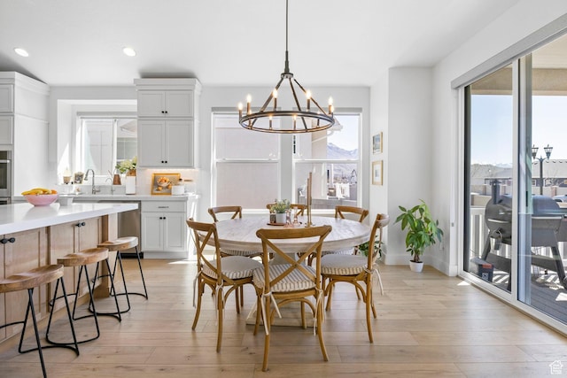 4947 W Evergreen Ln, Highland, UT 84003 - dining room with light wood-style flooring, a notable chandelier, baseboards, and recessed lighting