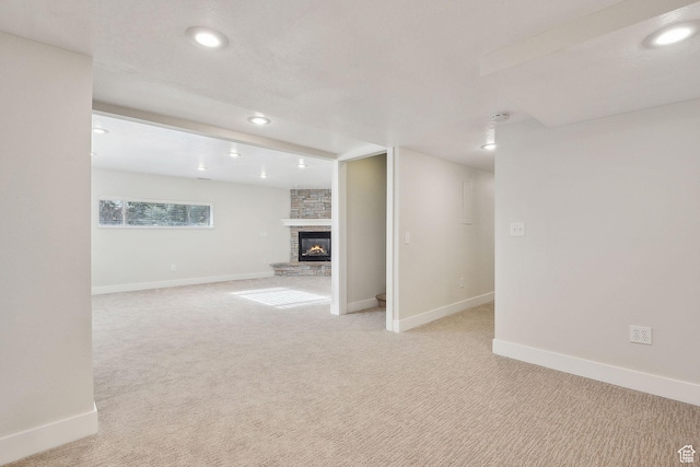32 E 500 S, Midway, UT 84049 - below grade area with recessed lighting, baseboards, light carpet, and a stone fireplace