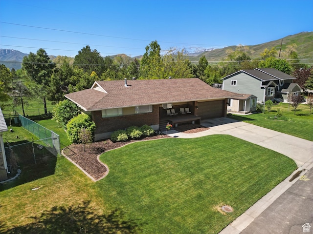 32 E 500 S, Midway, UT 84049 - ranch-style home featuring concrete driveway, an attached garage, a mountain view, and covered porch