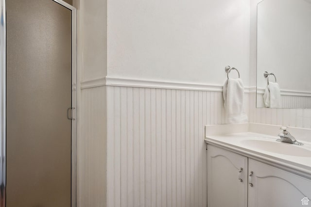 32 E 500 S, Midway, UT 84049 - full bath with a wainscoted wall, vanity, a stall shower, and a decorative wall