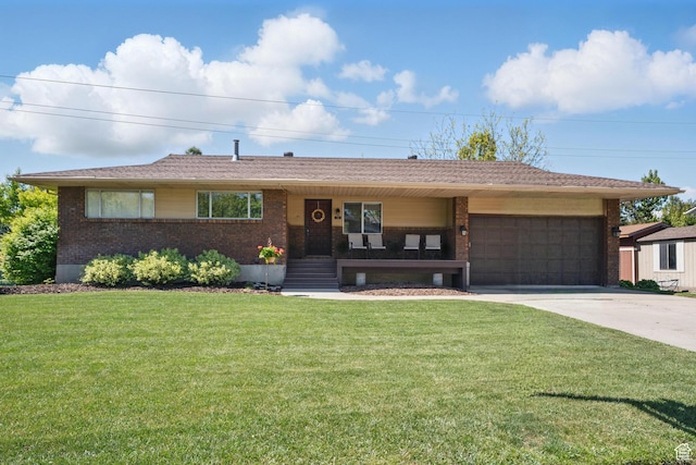 32 E 500 S, Midway, UT 84049 - ranch-style house with driveway, brick siding, a garage, a front yard, and covered porch