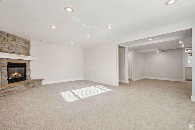 32 E 500 S, Midway, UT 84049 - unfurnished living room featuring light colored carpet, recessed lighting, a fireplace, and baseboards
