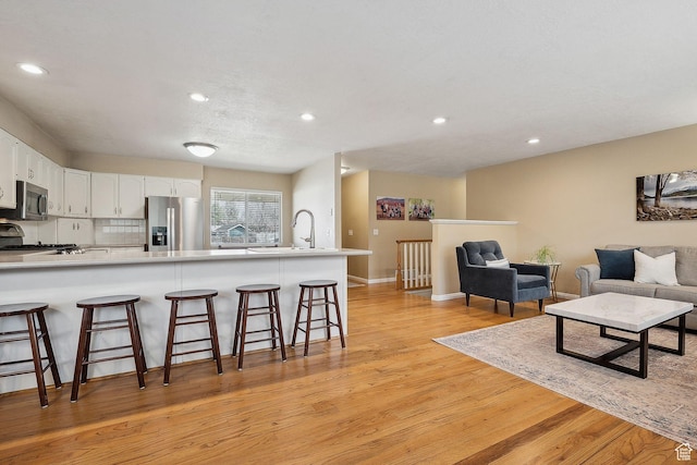 32 E 500 S, Midway, UT 84049 - living area featuring light wood finished floors, recessed lighting, and baseboards