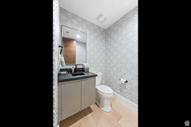 7290 Foxglove Ct, Park City, UT 84098 - bathroom featuring visible vents, baseboards, toilet, wallpapered walls, and vanity