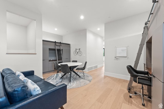 7290 Foxglove Ct, Park City, UT 84098 - office space with light wood finished floors, a barn door, baseboards, visible vents, and recessed lighting