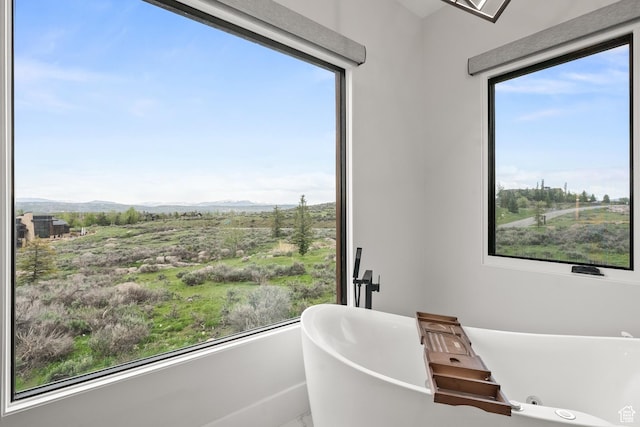 7290 Foxglove Ct, Park City, UT 84098 - full bath with a freestanding tub, a mountain view, and a healthy amount of sunlight