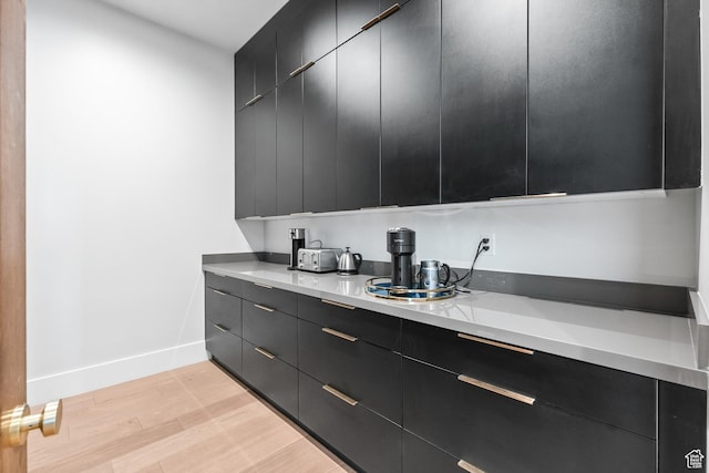 7290 Foxglove Ct, Park City, UT 84098 - kitchen featuring light countertops, dark cabinetry, baseboards, and light wood finished floors