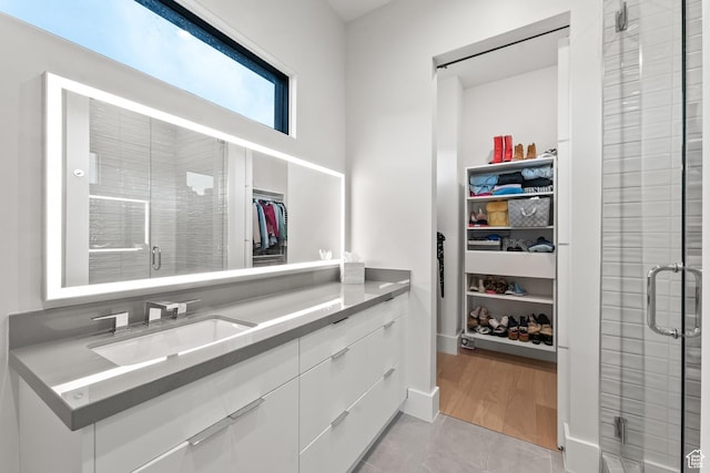 7290 Foxglove Ct, Park City, UT 84098 - bathroom featuring a stall shower, a walk in closet, and vanity