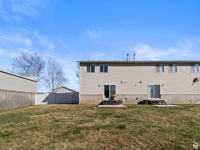 1929 W 680 N, Pleasant Grove, UT 84062 - back of property featuring a yard, fence, and entry steps