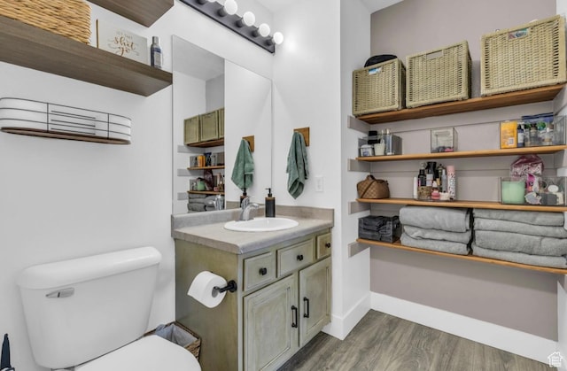 1929 W 680 N, Pleasant Grove, UT 84062 - bathroom with baseboards, wood finished floors, toilet, and vanity