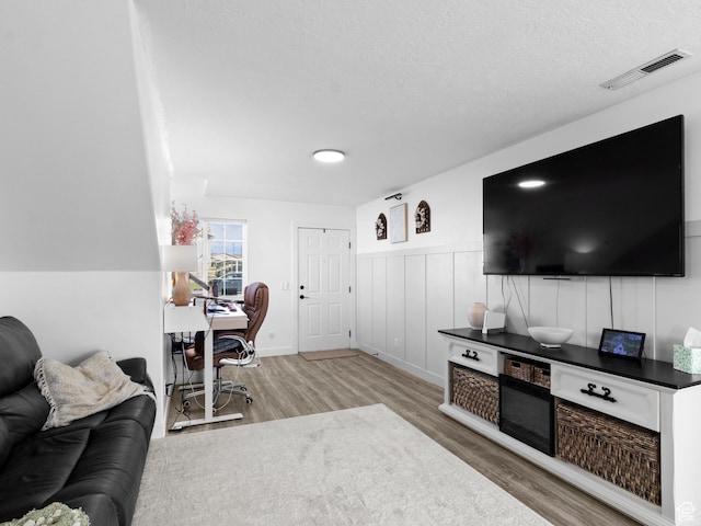1929 W 680 N, Pleasant Grove, UT 84062 - home office with visible vents, wood finished floors, wainscoting, and a textured ceiling