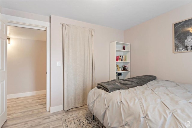 1321 E Daffodil Ct N Unit 155, Layton, UT 84040 - bedroom with baseboards and light wood-type flooring