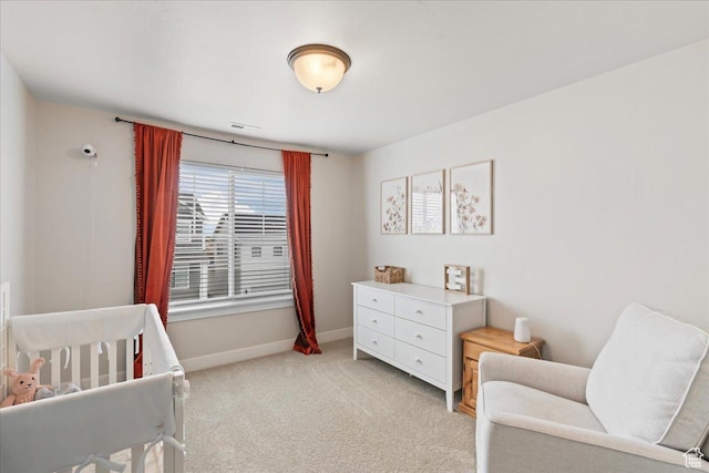 1321 E Daffodil Ct N Unit 155, Layton, UT 84040 - bedroom featuring baseboards, visible vents, a crib, and light carpet