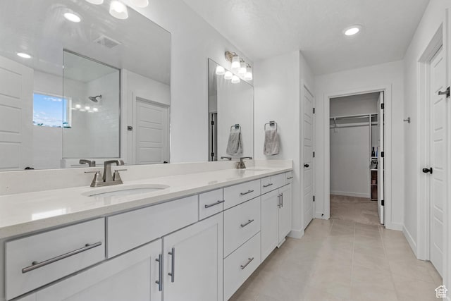 217 S Buckhorn Bath Ave W, Saratoga Springs, UT 84045 - full bath with double vanity, a tile shower, a sink, and tile patterned floors