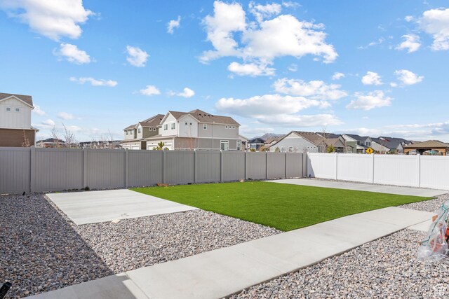 217 S Buckhorn Bath Ave W, Saratoga Springs, UT 84045 - view of yard with a fenced backyard, a residential view, and a patio area