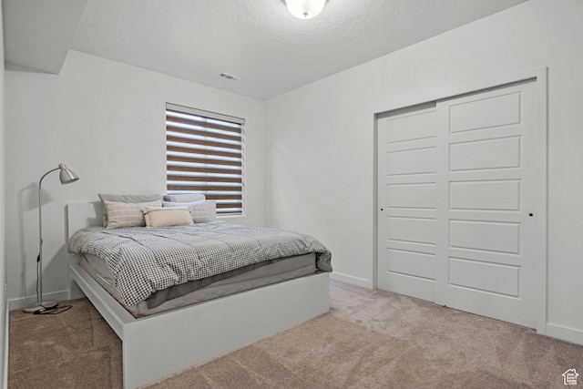 217 S Buckhorn Bath Ave W, Saratoga Springs, UT 84045 - carpeted bedroom featuring baseboards, a closet, a textured ceiling, and visible vents