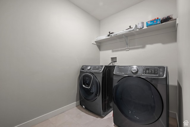 217 S Buckhorn Bath Ave W, Saratoga Springs, UT 84045 - laundry area with baseboards, separate washer and dryer, laundry area, and light tile patterned floors